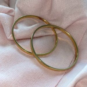 Two never worn MONET bracelets- pure gold- size small